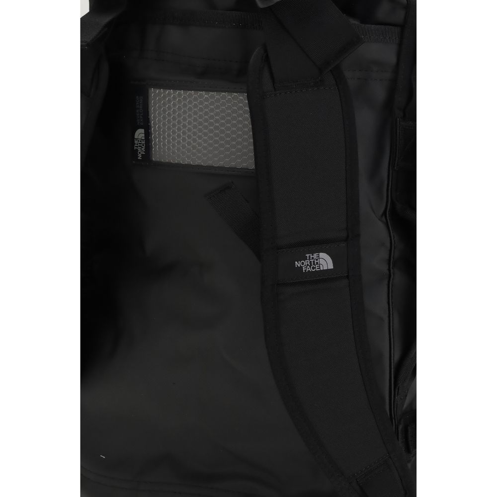 Interior view of The North Face Black Nylon Luggage And Travel, showcasing rugged design and padded handles for versatility.