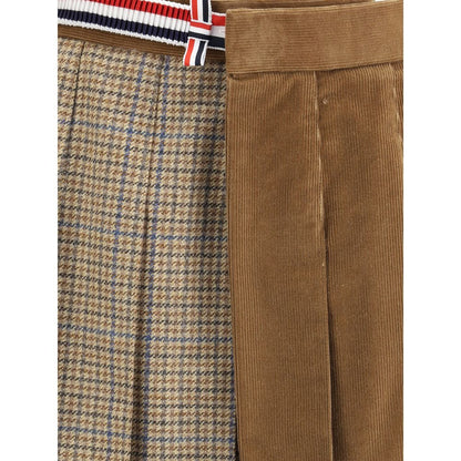 Close-up of Thom Browne Brown Wool Mini Skirt with pleated velvet and houndstooth design, striped side band, and side pockets.