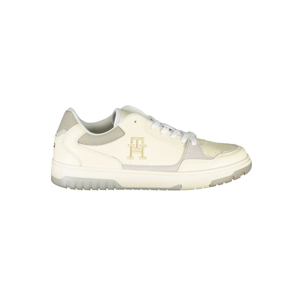 Tommy Hilfiger Beige Sports Sneakers with Unique Embroidery showing side view of sleek design and logo detail.