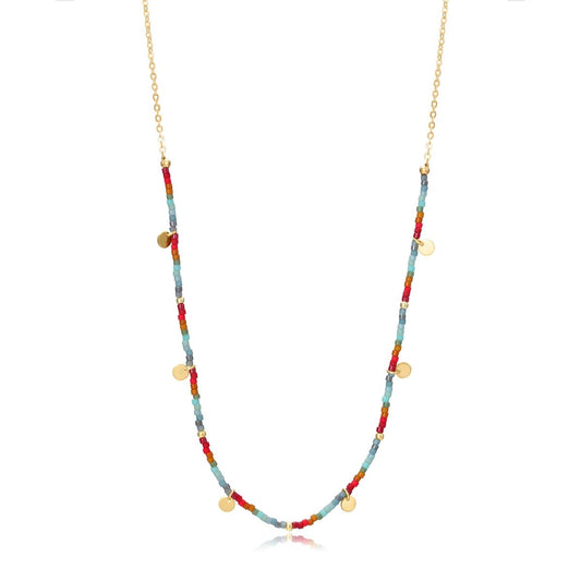 Colorful beaded necklace with gold accents, alternative jewelry style, perfect for layering, displayed on a white background.