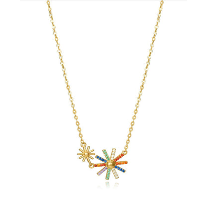 Colorful starburst pendant necklace with vibrant stones on a gold chain.