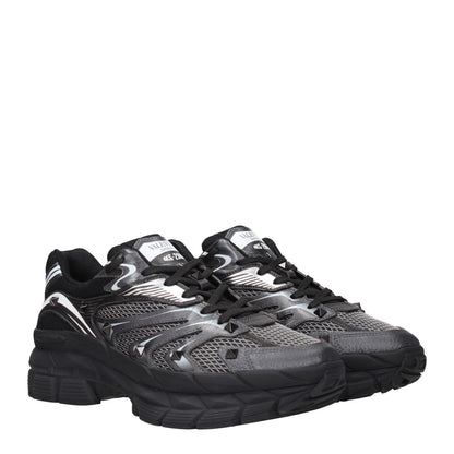 Valentino Garavani Black Fabric Athletic Sneakers with rubber sole and lace-up closure, featuring studded design and logos.