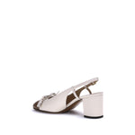 Valentino Garavani Valet Du Roi Pumps in two-tone leather with VLogo detail, slingback style, and tassel bow, side view.