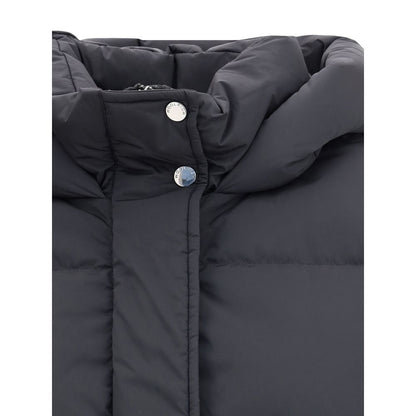 Close-up of Woolrich Black Goose Down Coat with hood and button details, showcasing quilted design for warmth and comfort.