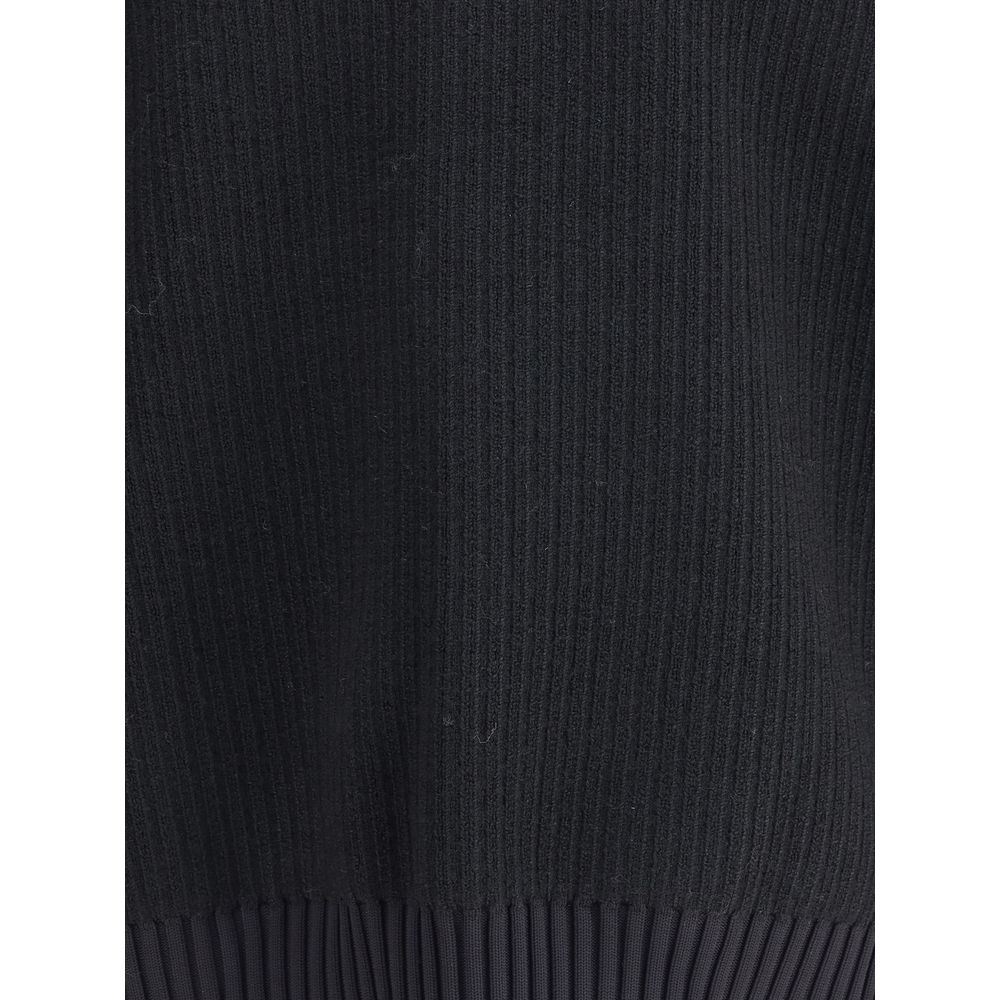 Close-up texture of Y-3 Black Wool Sweatshirt showcasing ribbed design and craftsmanship in high-quality wool fabric.